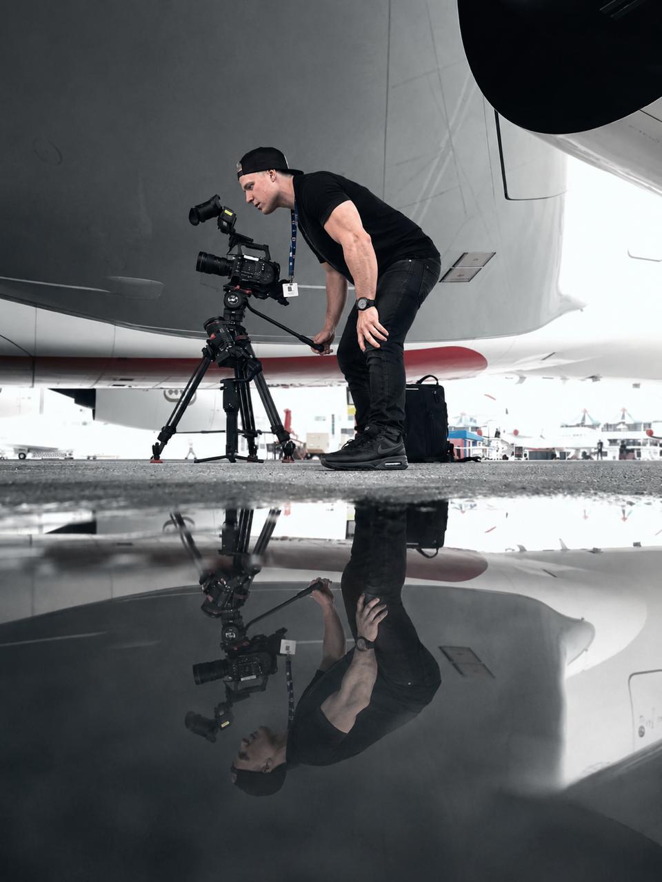 Ryan Baker on location with drone and camera in the South African countryside